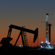 An oil rig and pump jack in Midland, Texas.